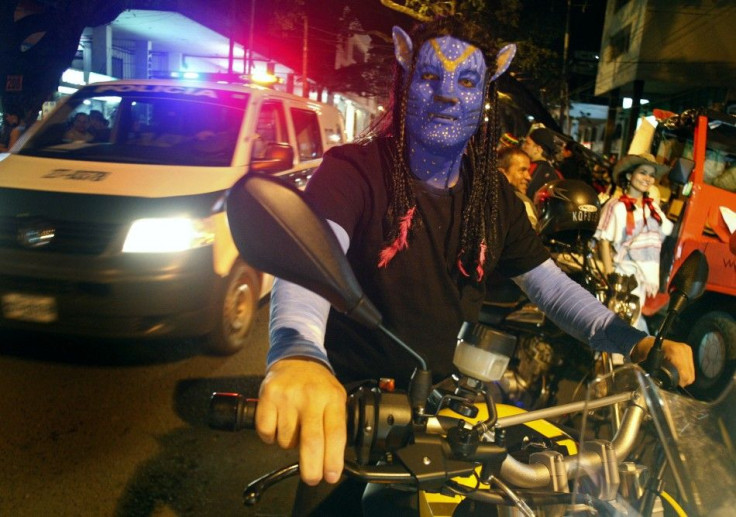 A man dressed as a character from the movie Avatar takes part in the &quot;Moto Halloween Party 2010&quot; in Cali