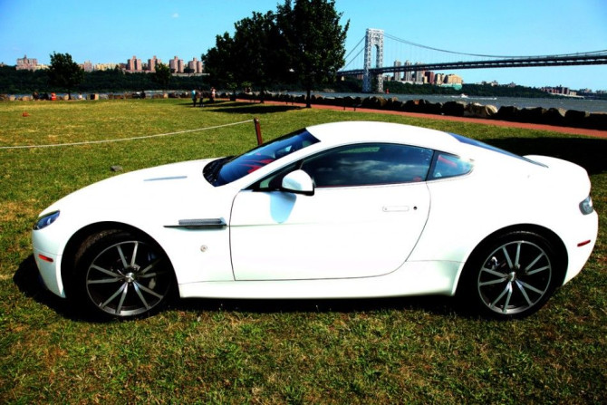 The 2012 Aston Martin V8 Vantage parked, seen from the side.