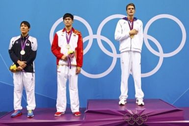 Gold medallist Yannick Agnel of France poses with silver medallists Park Tae-hwan (L) of South Korea and Sun Yang (R) of China during the men&#039;s 200m freestyle victory ceremory at the London 2012 Olympic Games at the Aquatics Centre