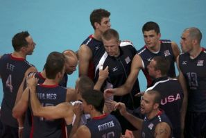 U.S. players celebrate winning their men&#039;s Group B volleyball match against Germany at the London 2012 Olympic Games at Earls Court