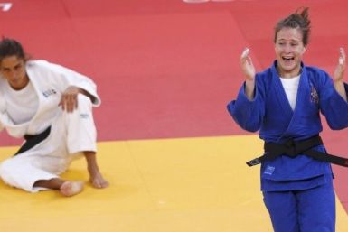 Marti Malloy of U.S. celebrates after defeating Italy&#039;s Giulia Quintavalle in women&#039;s -57kg bronze medal A judo match at London 2012 Olympic Games