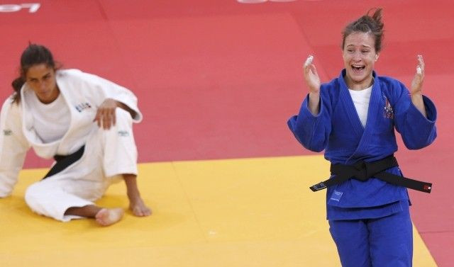 Marti Malloy of U.S. celebrates after defeating Italy's Giulia Quintavalle in women's -57kg bronze medal A judo match at London 2012 Olympic Games
