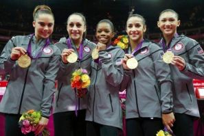 Team U.S.A members McKayla Maroney, Jordyn Wieber, Gabrielle Douglas, Alexandra Raisman, and Kyla Ross pose with their gold medals 
