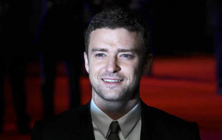 Justin Timberlake poses for photographers at the British premiere of the film "In Time" at the Curzon Mayfair cinema in London October 31, 2011