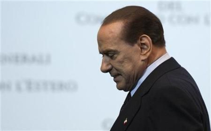 Italy Prime Minister Silvio Berlusconi leaves at the end of a meeting in Rome