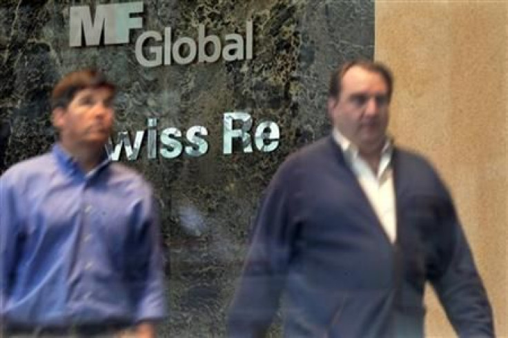 Two men exit the office complex where MF Global Holdings Ltd have an office on 52nd Street in midtown Manhattan New York