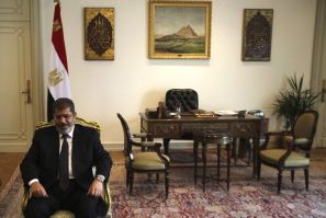 Egyptian President Mohammed Mursi seated