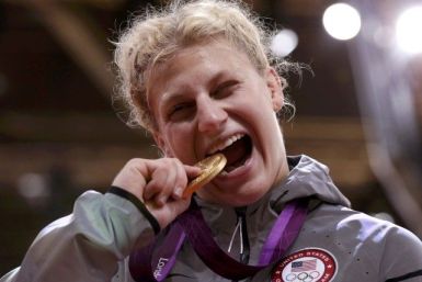 Gold medallist Kayla Harrison of the U.S. celebrates during awards ceremony for women&#039;s -78kg judo competition at London 2012 Olympic Games