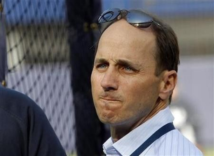 New York Yankees General Manager Brian Cashman looks on during Yankees batting practice before their MLB American League baseball game against the Chicago White Sox in New York