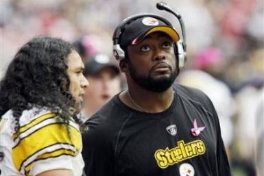 Pittsburgh Steelers coach Mike Tomlin looks at the scoreboard as he talks with safety Troy Polamalu Polamalu during their NFL game in Houston in this October 2, 2011 file photo After a crushing loss to the Baltimore Ravens on the opening day of the 2011 s