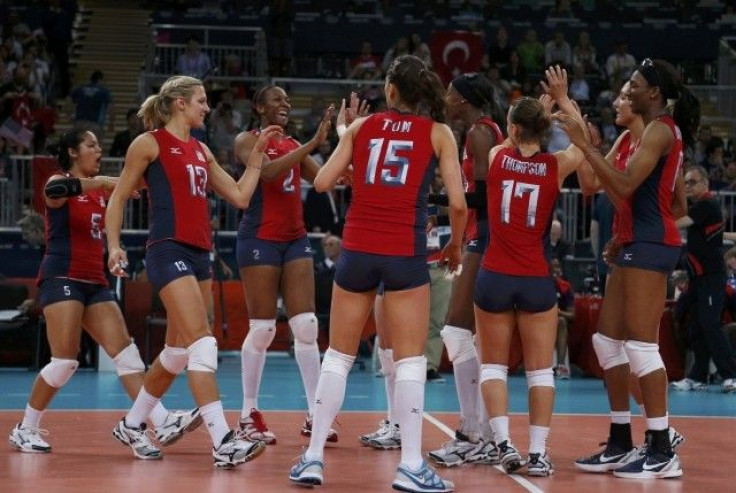 Players of the U.S. celebrate defeating Turkey during their women&#039;s Group B volleyball match