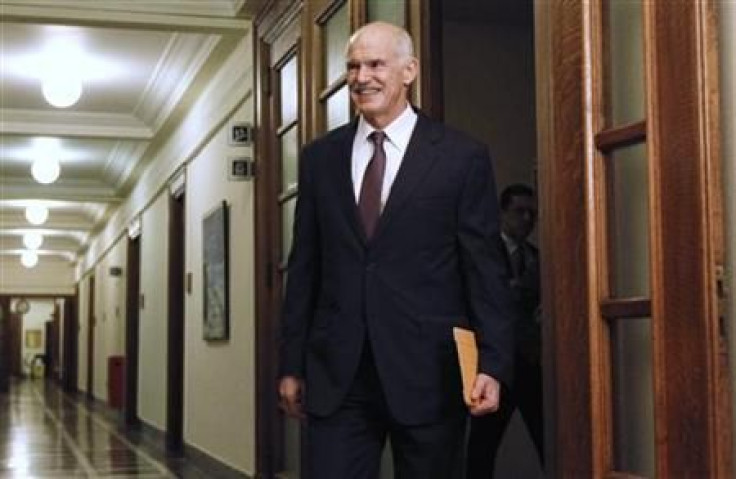 Greece&#039;s PM Papandreou arrives for a cabinet meeting inside the parliament in Athens