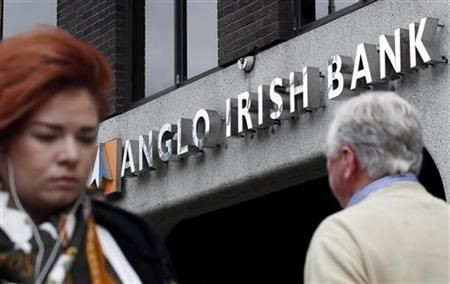 Pedestrians walk past a branch of Anglo Irish Bank in Dublin