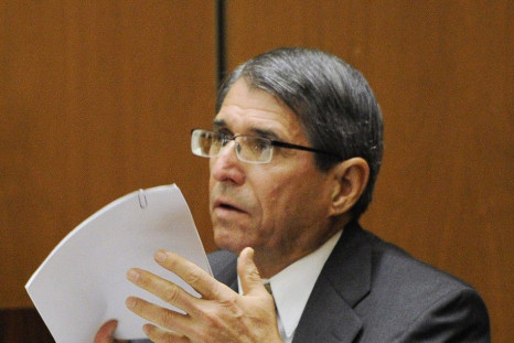 Dr. Paul White reviews a document during the final stage of Dr. Conrad Murray&#039;s defense during his involuntary manslaughter trial in the death of singer Michael Jackson at the Los Angeles Superior Court