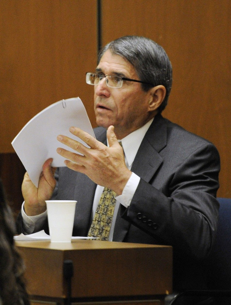 Dr. Paul White reviews a document during the final stage of Dr. Conrad Murray&#039;s defense during his involuntary manslaughter trial in the death of singer Michael Jackson at the Los Angeles Superior Court