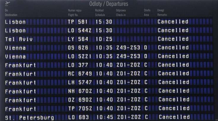 A departure information board with cancelled flights is pictured in the closed Warsaw airport
