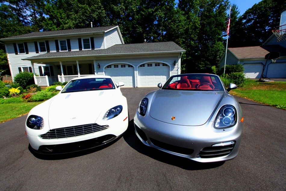 Two gorgeous cars, the Aston Martin V8 Vantage left and the 2013 Porsche Boxster S parked in Saratoga Springs.