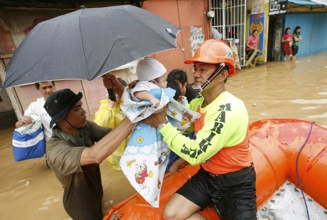 A Baby Handed Over to Rescuers