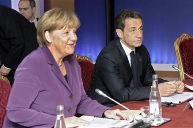 France&#039;s President Sarkozy and Germany&#039;s Chancellor Merkel attend crisis talks in Cannes on the eve of the G20 summit