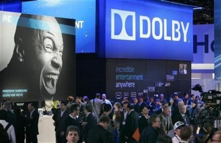 Show-goers pass by the Dolby booth during the 2010 International Consumer Electronics Show (CES) in Las Vegas, Nevada