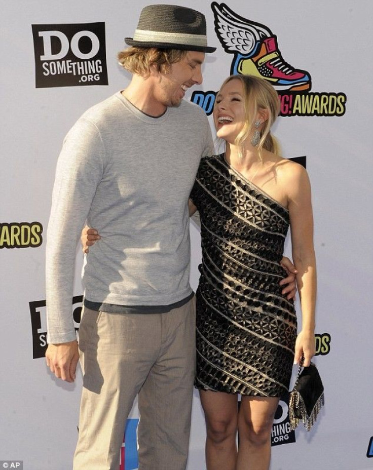 Kristen Bell and Dax Shepard having a laugh on the red carpet