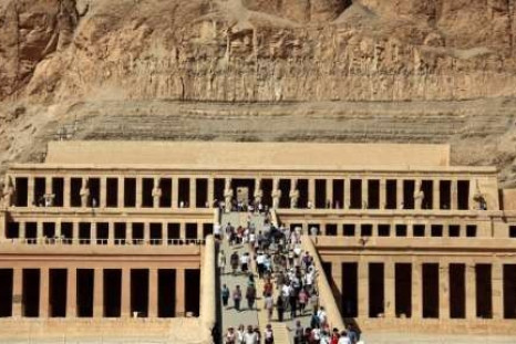 Tourists walk on the stairs leading to Queen Hatshepsut Temple in Luxor, southern Egypt, November 9, 2009. 