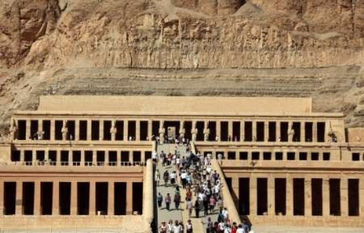 Tourists walk on the stairs leading to Queen Hatshepsut Temple in Luxor, southern Egypt, November 9, 2009. 