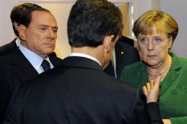 France&#039;s President Sarkozy speaks with Germany&#039;s Chancellor Merkel and Italy&#039;s Prime Minister Berlusconi during a Eurozone meeting before the start of the G20 Summit of major world economies in Cannes