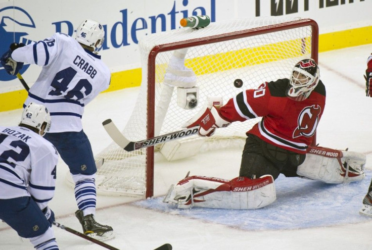 Toronto Maple Leafs Joey Crabb scores against New Jersey Devils Martin Brodeur in Newark