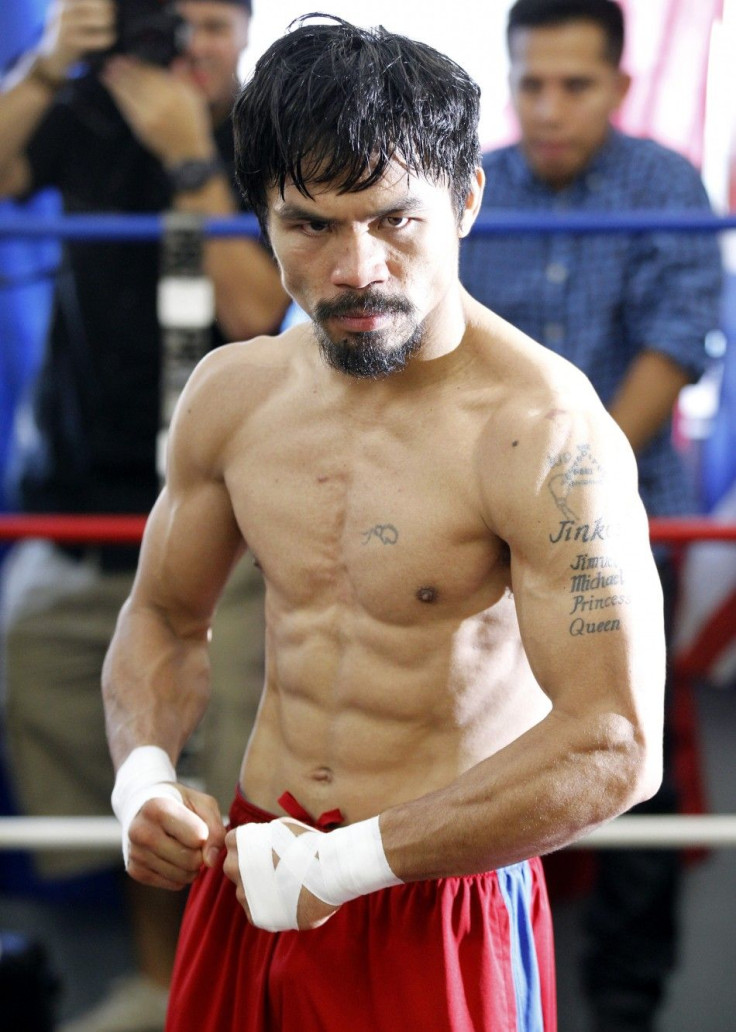 Congressman and boxer Manny Pacquiao of the Philippines poses during a media workout at Wild Card Boxing Club in Los Angeles