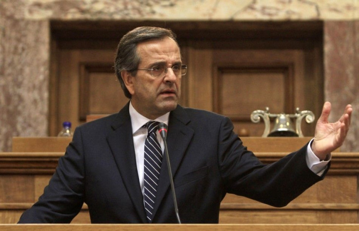Leader of Greek conservative New Democracy party Antonis Samaras delivers a speech to his parliamentarians inside the parliament in Athens