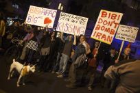 Israelis hold placards as they protest, against a possible attack of Iran's nuclear facilities, in Tel Aviv, Reuters