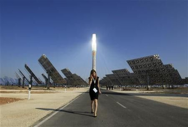 A woman walks at the new solar power plant &#039;&#039;Gemasolar&#039;&#039; the day of its inauguration in Fuentes de Andalucia, southern Spain