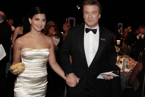 Alec Baldwin and his new wife Hilaria Thomas hold hands during a Hollywood event