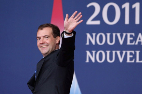 Russia's President Dmitry Medvedev waves as he arrives for the G20 Summit of major world economies in Cannes