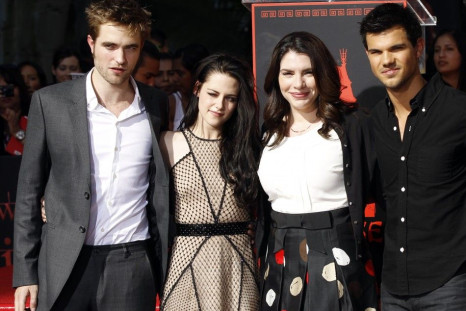 Writer Stephenie Meyer (second from right) poses with actors Robert Pattinson (left), Kristen Stewart and Taylor Lautner at their hand and footprint ceremony at the Grauman's Chinese Theatre in Hollywood, California November 3, 2011.
