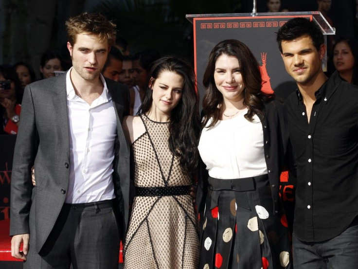 Writer Stephenie Meyer (second from right) poses with actors Robert Pattinson (left), Kristen Stewart and Taylor Lautner at their hand and footprint ceremony at the Grauman's Chinese Theatre in Hollywood, California November 3, 2011.