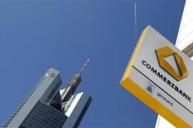 A logo of Germany&#039;s Commerzbank is seen in bright sunshine next to the headquarters of the bank in Frankfurt