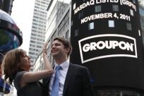 Groupon CEO Mason poses with his fiancee, pop musician Gillespie, outside Nasdaq Market in New York