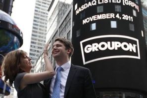 Groupon CEO Mason poses with his fiancee, pop musician Gillespie, outside Nasdaq Market in New York