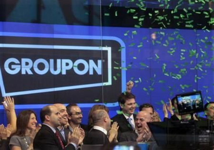 Employees and guests of Groupon ring the opening bell 