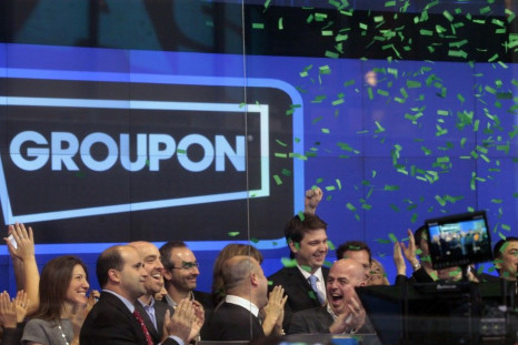 Employees and guests of Groupon ring the opening bell in celebration of the company's IPO at the Nasdaq Market in New York