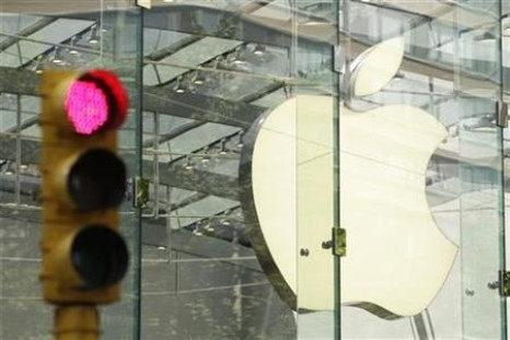 The Apple logo shines inside of an Apple Store in New York