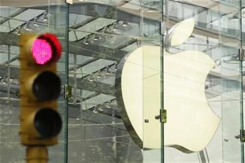 The Apple logo shines inside of an Apple Store in New York