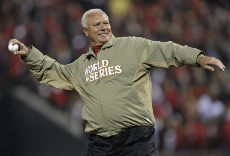 Bob Forsch throws out ceremonial first pitch before the Cardinals met the Texas Rangers in Game 7 of MLB's World Series baseball championship in St. Louis
