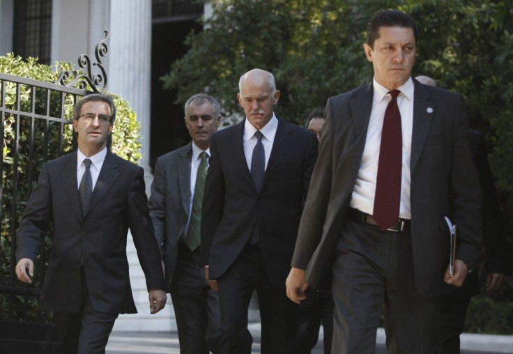 Greek PM Papandreou walks towards the Presidential Palace in Athens