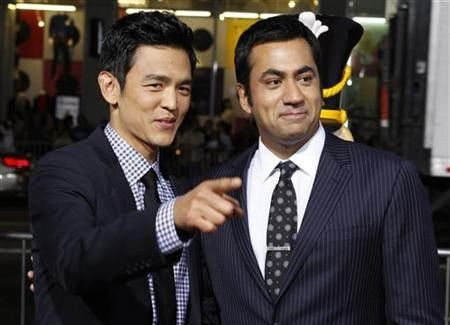 Actors John Cho (L) and Kal Penn pose at the premiere of their new film ''A Very Harold & Kumar 3D Christmas'' in Hollywood