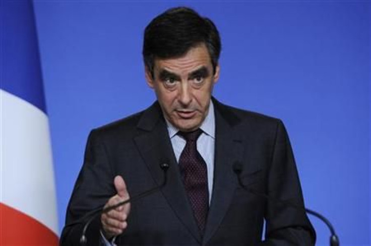 France's Prime Minister Fillon attends a news conference following a meeting with major French bankers about the Greece debt at the Hotel Matignon in Paris