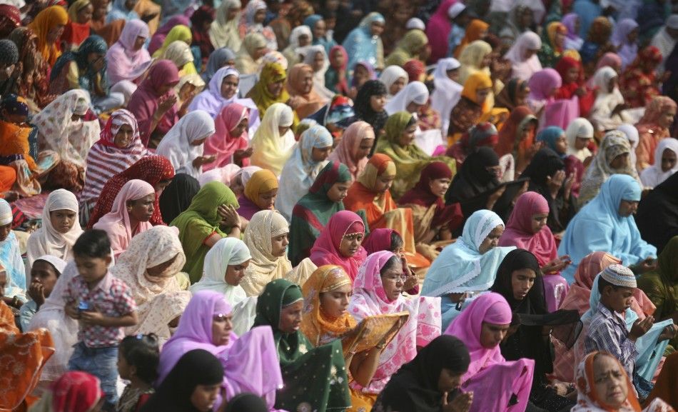 Muslim women offer prayers at a mosque on the eve of the Eid al-Adha festival on the outskirts of the western Indian city of Ahmedabad November 6, 2011.