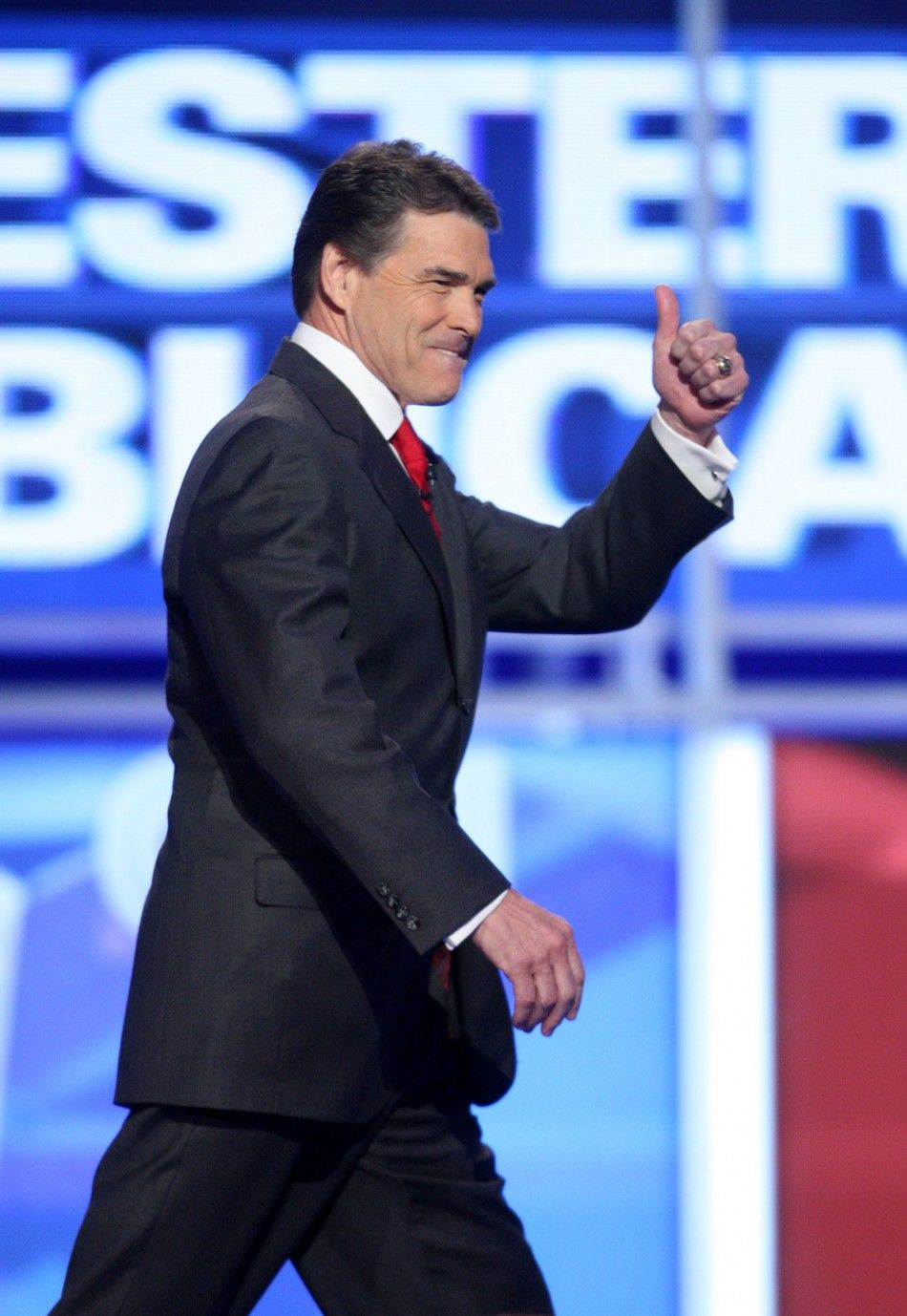 Republican presidential candidate Texas Governor Rick Perry arrives for the start of the CNN Western Republican presidential debate in Las Vegas, Nevada, October 18, 2011.